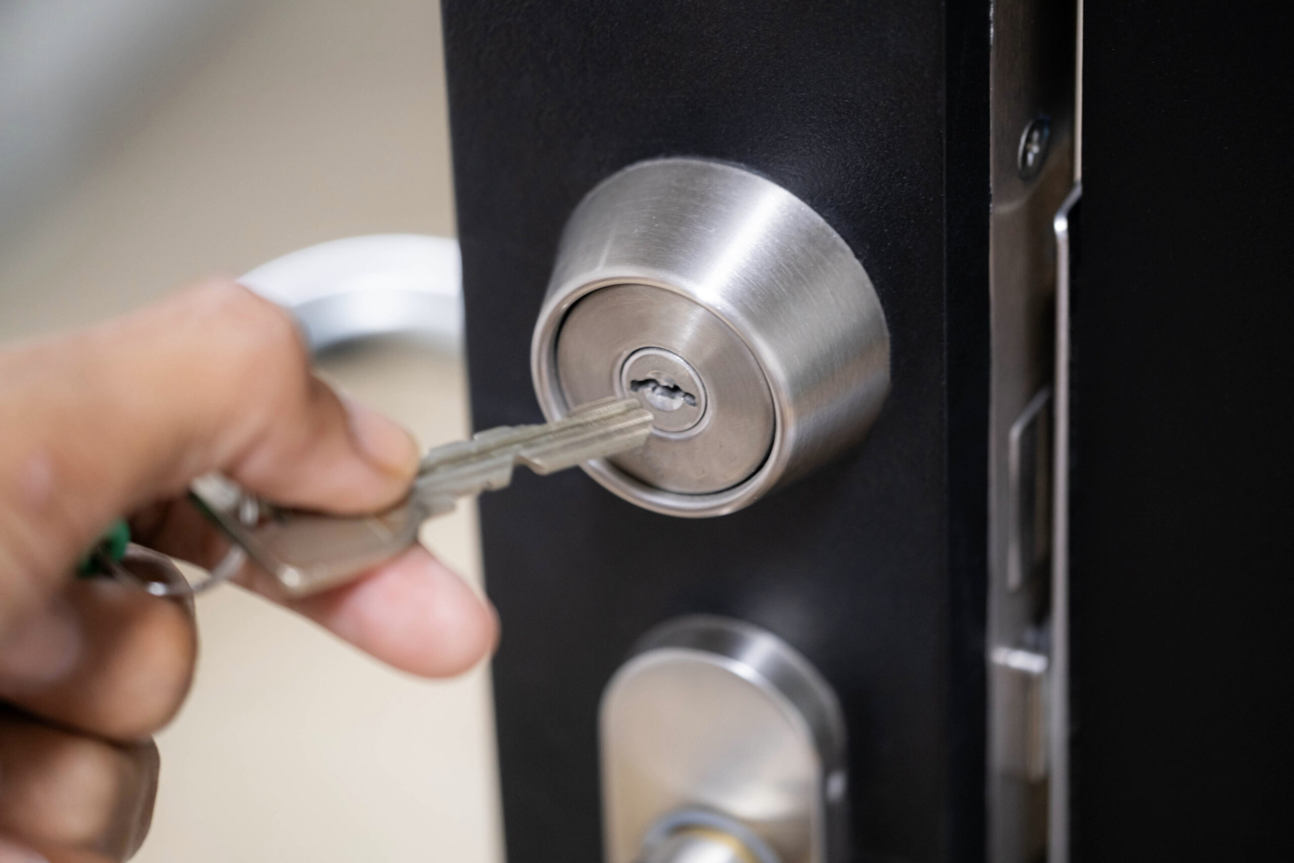 inserting key into lock